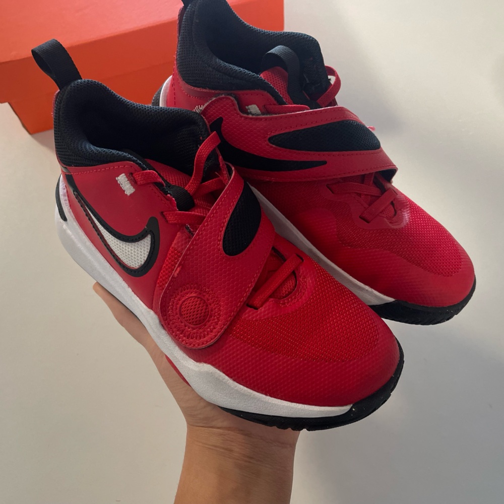 Red Nike Team Hustle sneakers